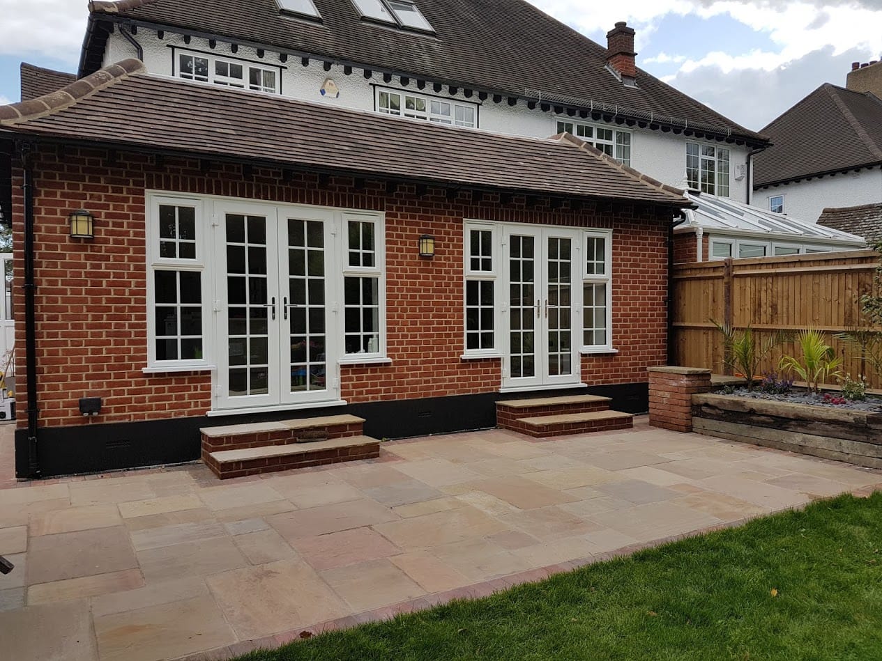 back of house brick extension with 2 double doors